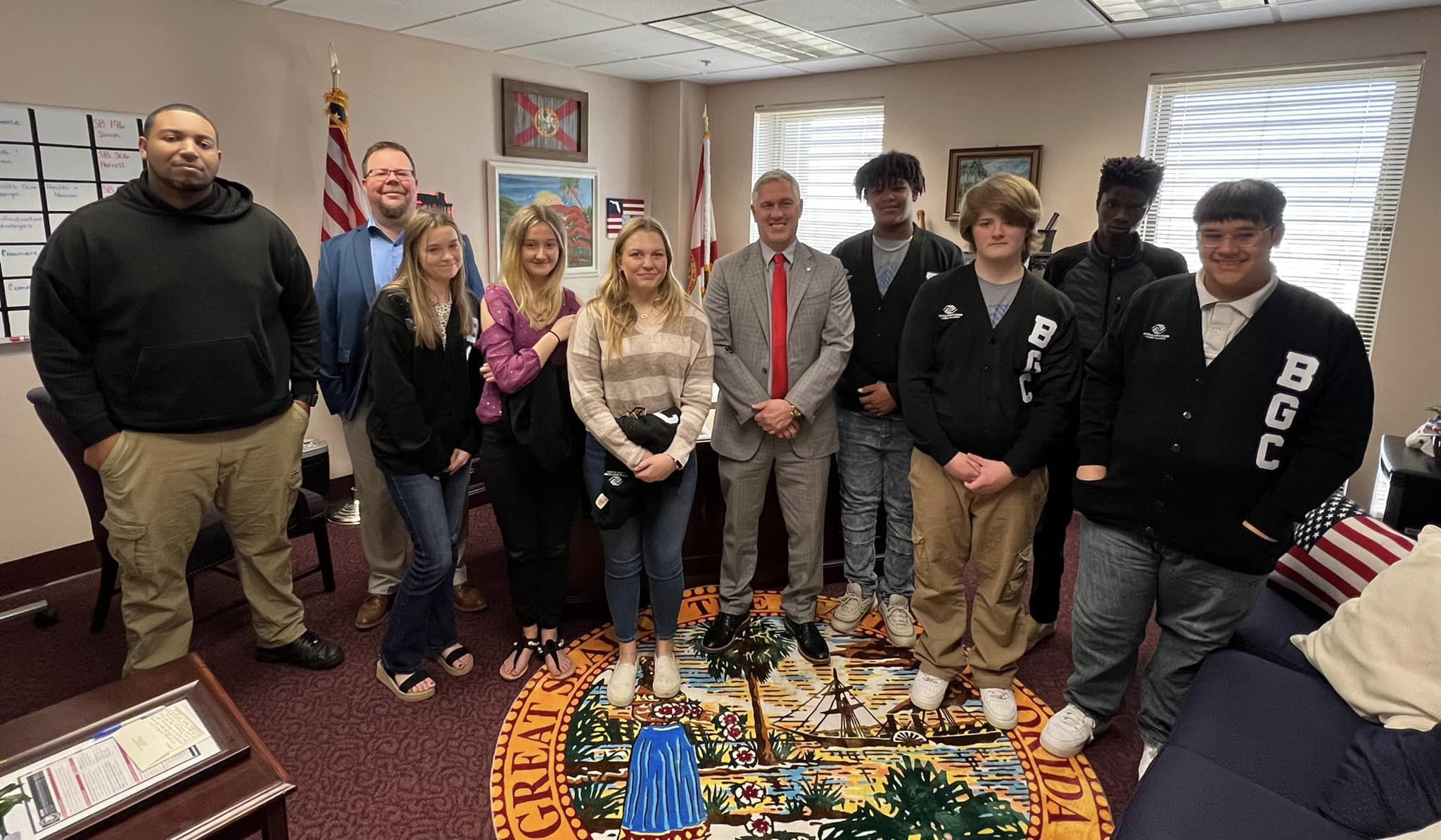 Shane Abbott with Boys and Girls Club students in his Tallahassee office