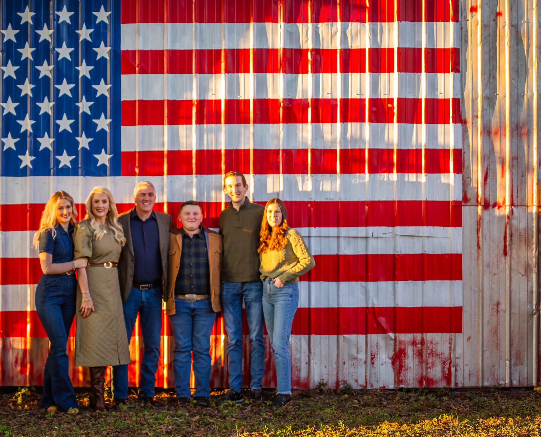 Shane Abbott and family in front of American flag